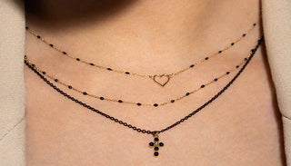 una composizione fatta da tre gioielli in oro che suggeriamo per un evento importante come il battesimo