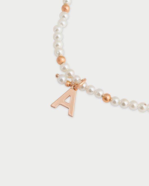 Pulsera elástica con perlas y bolitas - LETRA