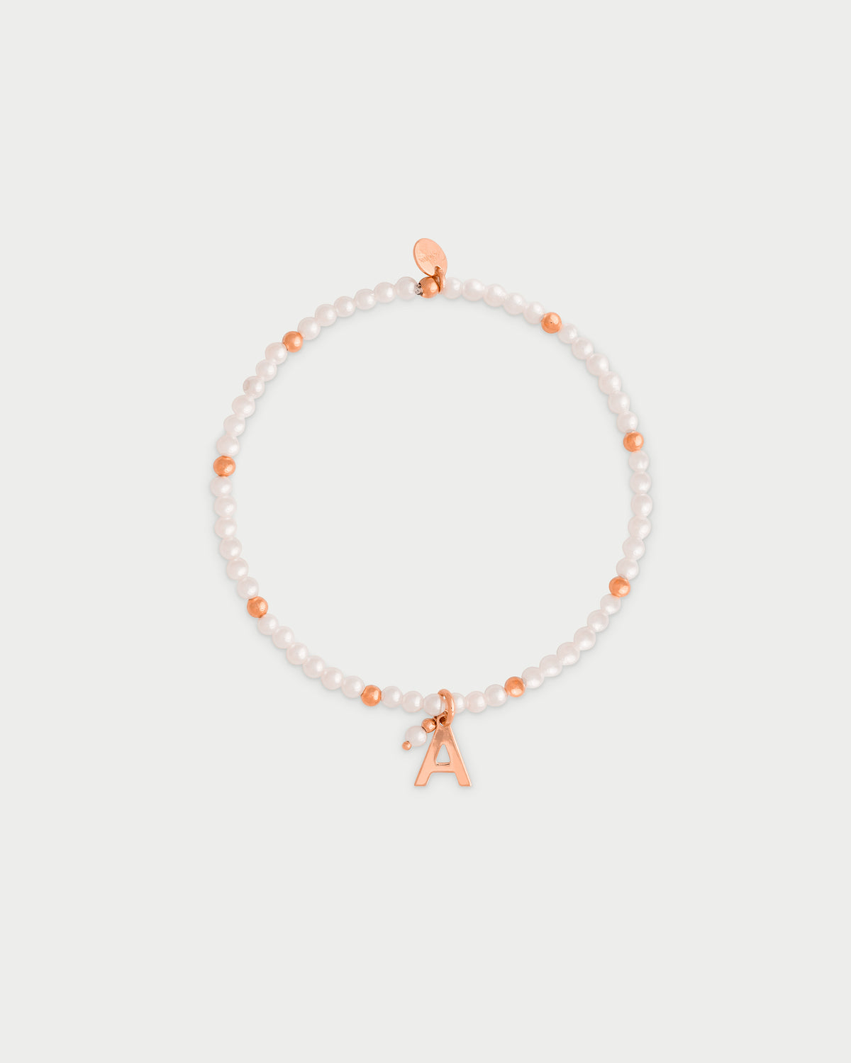 Pulsera elástica con perlas y bolitas - LETRA