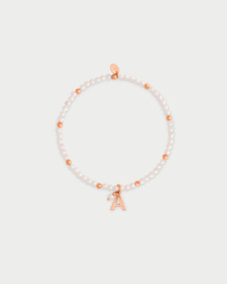 Pulsera elástica con perlas y bolitas - LETRA