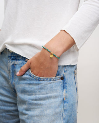 Elastic bracelet with micro stones and clover pendant