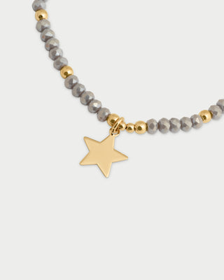 Pulsera elástica con micro piedras y colgante estrella