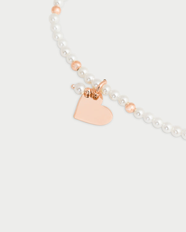 Pulsera elástica con perlas y bolitas - CORAZON