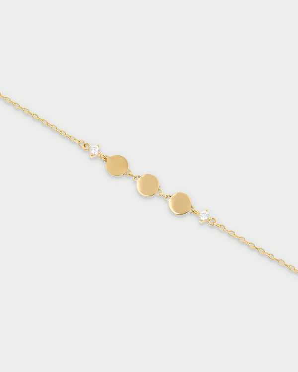 Pulsera con tres discos y punto de luz