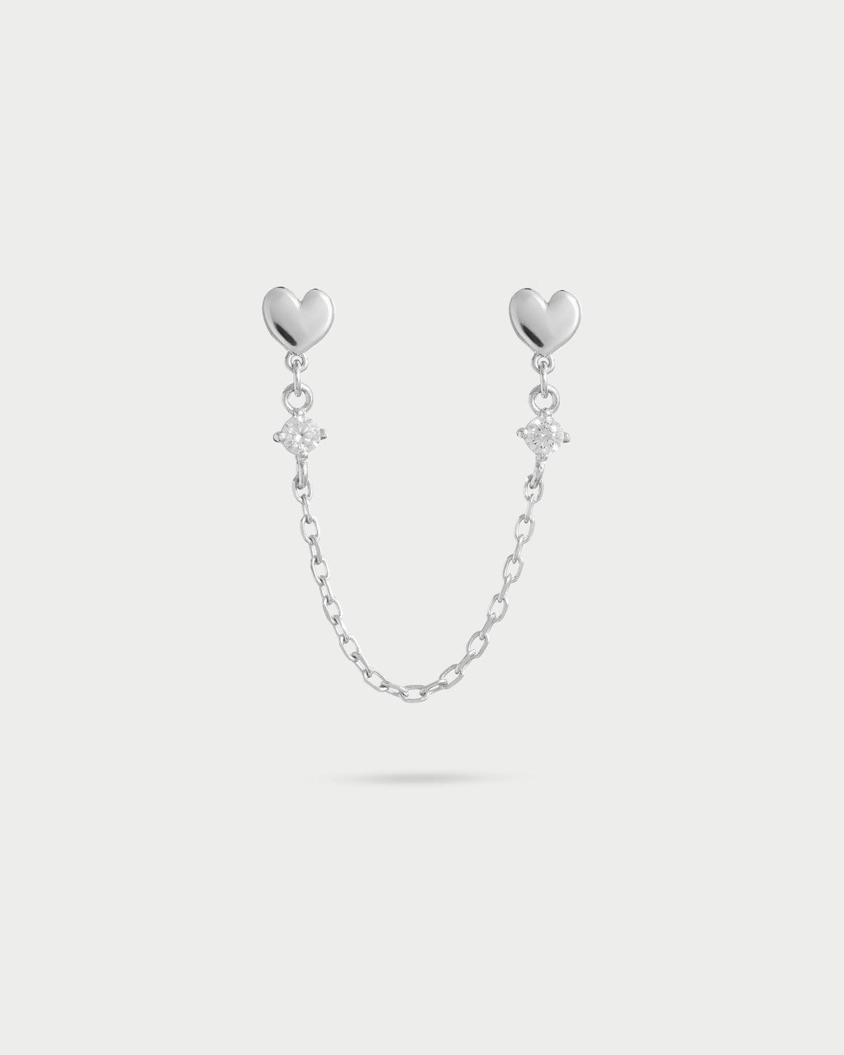 Orecchino double lobo catenella cuore con punto luce