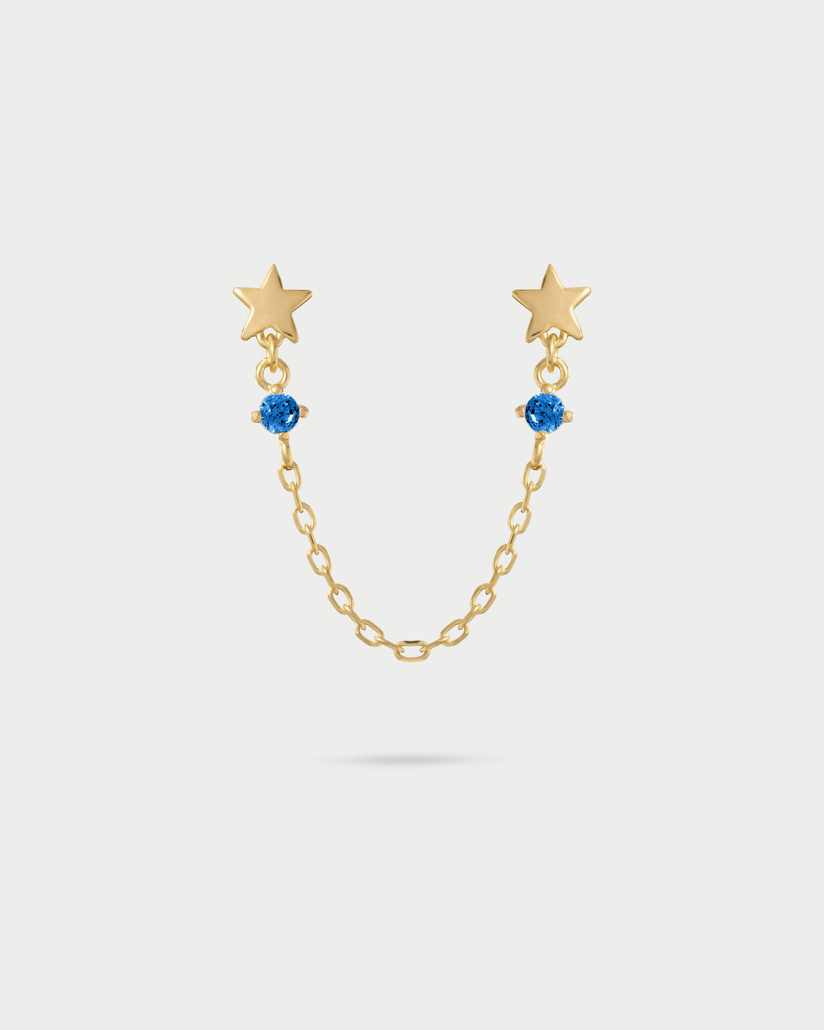Orecchino double lobo catenella stelle con punto luce