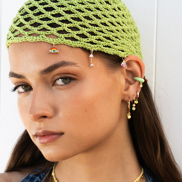 Campagna estiva Rue des Mille con gioielli abbinati a look mare, visual ispirazionale per playlist musicale italiana